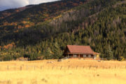 House in a field with mountains – How to purchase remote NW property
