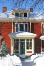 red house in snow, winter curb appeal