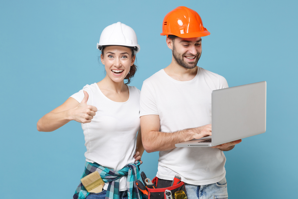 couple with laptop, home renovation, thumbs up