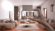 person taking photo of living room with smart phone, real estate listing