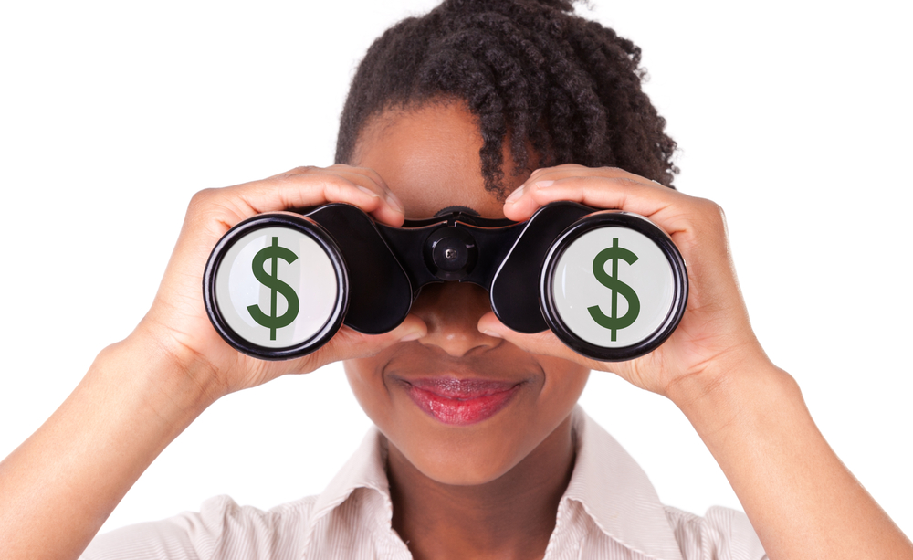 woman using binoculars, dollar signs, real estate